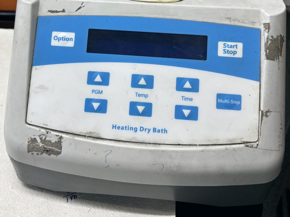 A worn dry bath keypad, its labels rubbed away.