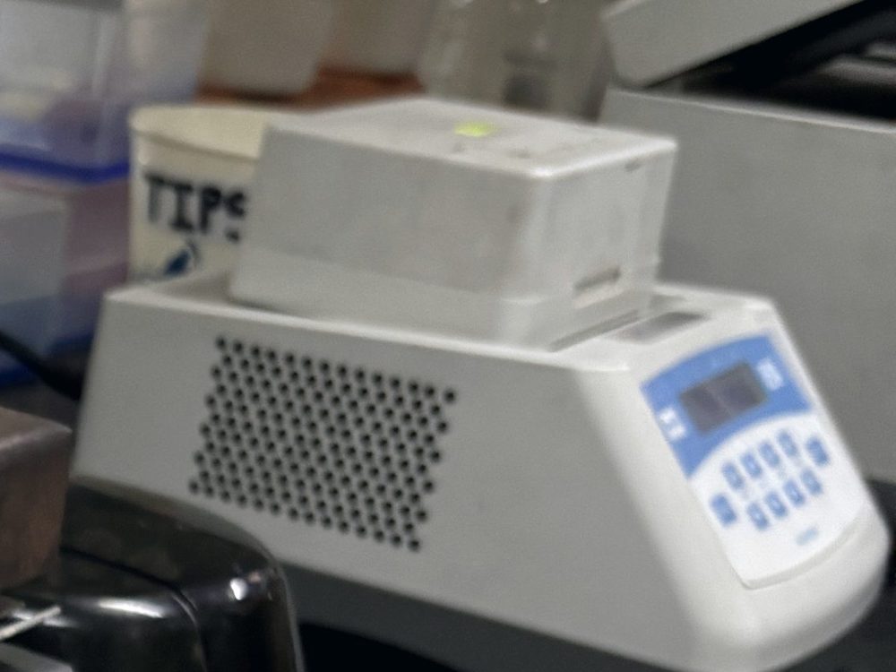 The control panel of a heating dry bath on a laboratory bench.
